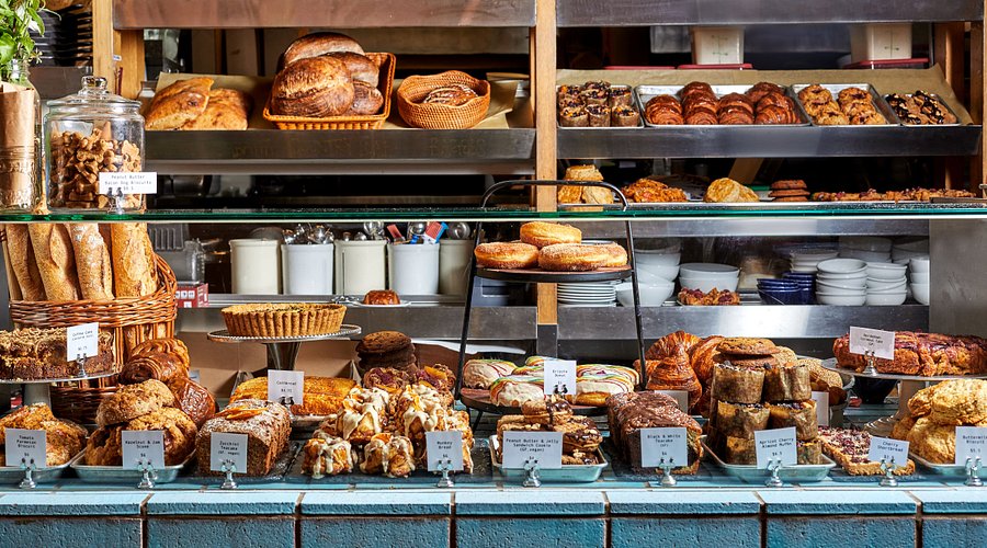 Seeded wholegrain loaf sliced on rustic table
