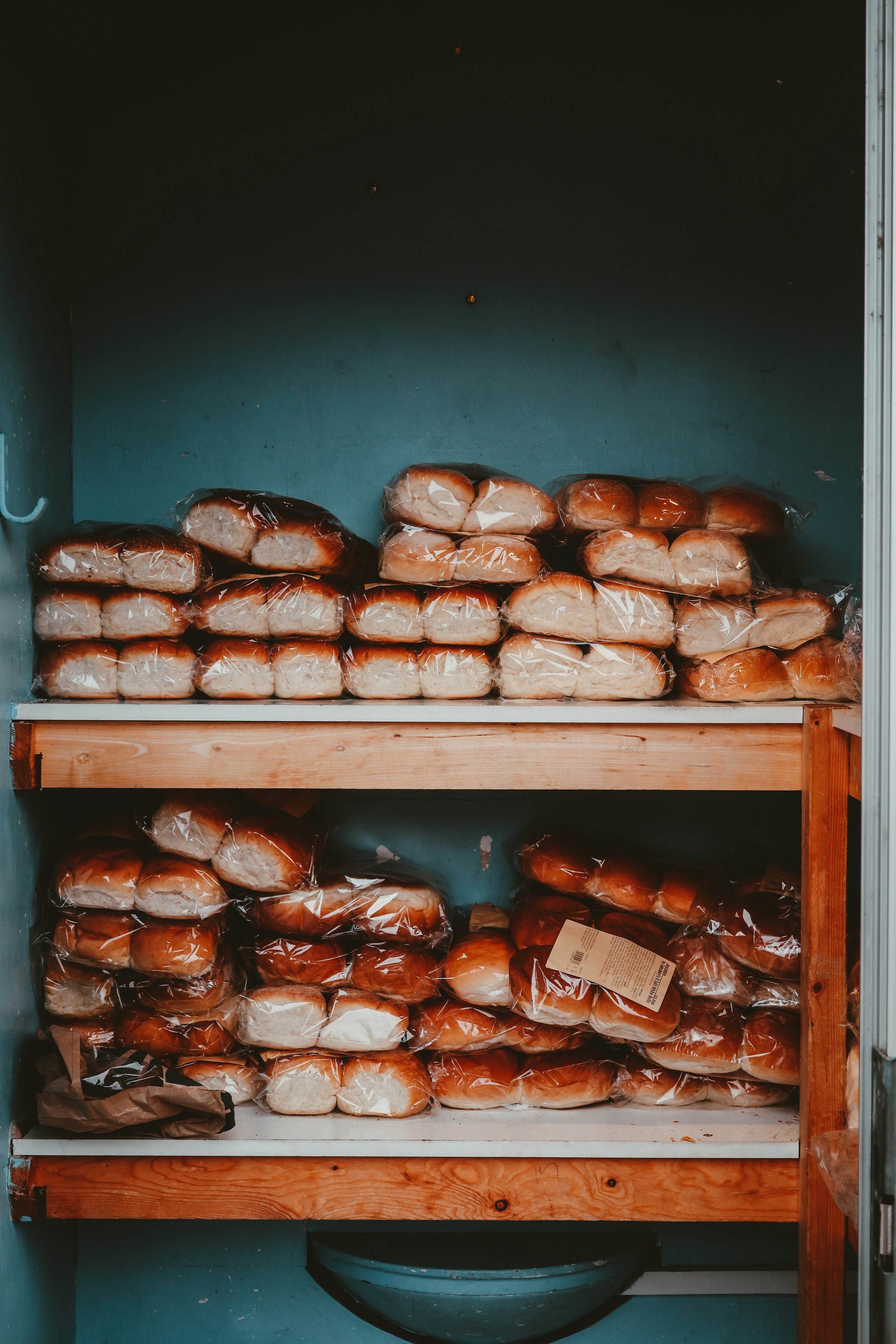 Catering trays and stacked bread loaves prepared for an event
